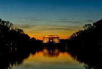 Looking across the reflecting pool to the Lincoln Memorial at dusk.