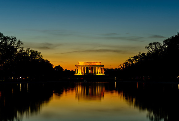 Looking across the reflecting pool to the Lincoln Memorial at dusk.