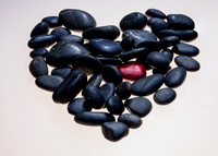 Conceptual photo. The original idea was to photograph the one red rock mixed in with the other black ones, when I laid the rocks out they naturally took a shape that resembled a heart so that gave me