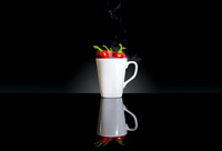 Just an abstract experiment of "hot" chilis in a mug.