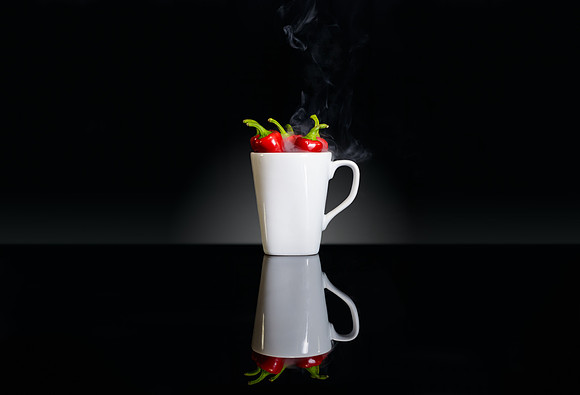Just an abstract experiment of "hot" chilis in a mug.