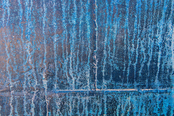 Abstract image of a giant bronze urn with colorful patina at the Forbidden City in Beijing, China.