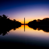 Looking across the reflecting pool to the Washington Monument at sunrise.