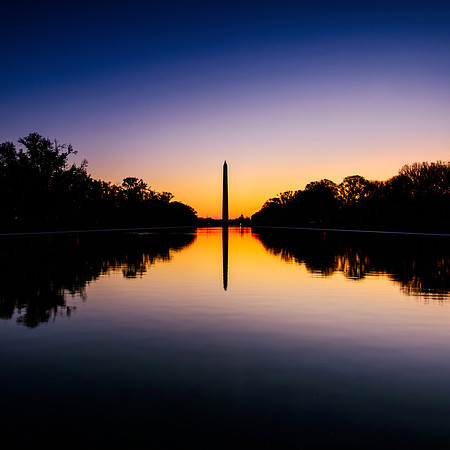 Looking across the reflecting pool to the Washington Monument at sunrise.