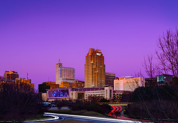 View of the Raleigh North Carolina skyline at rush hour in January.